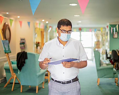 care manager studying a clipboard